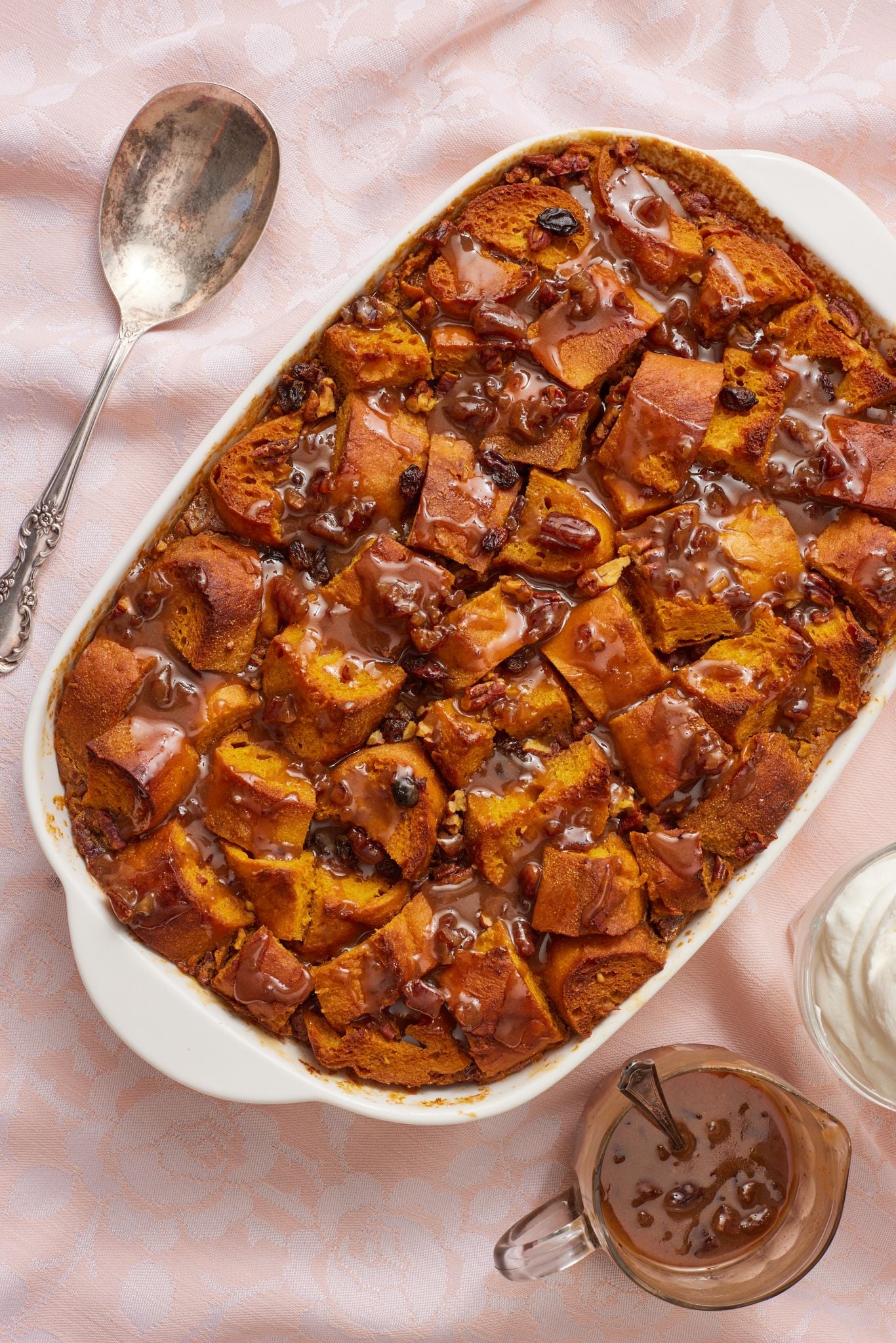 Top down view of pumpkin bread pudding drizzled with praline sauce.