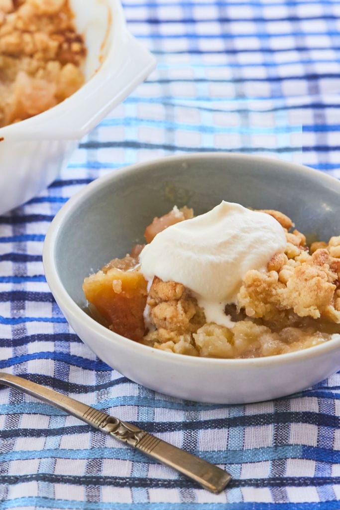 Irish Apple Crumble is golden, crumbly, and soft. It's served with ice cream on top.