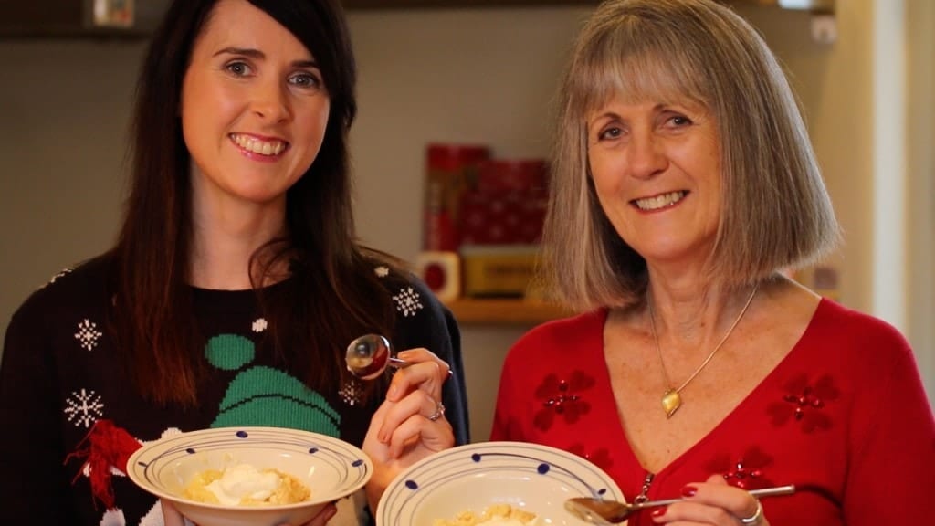 Gemma Stafford with her mom, Patricia Stafford, holding bowls of authentic Irish Apple Crumble.