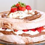 Chocolate Pavlova with chocolate cream & Fresh Strawberries . An incredibly decadent dessert that is much easier to make then it looks. (GF)