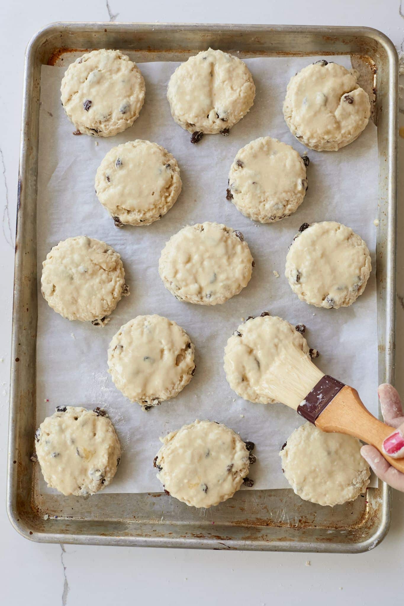 Brush egg wash on each scone top. 