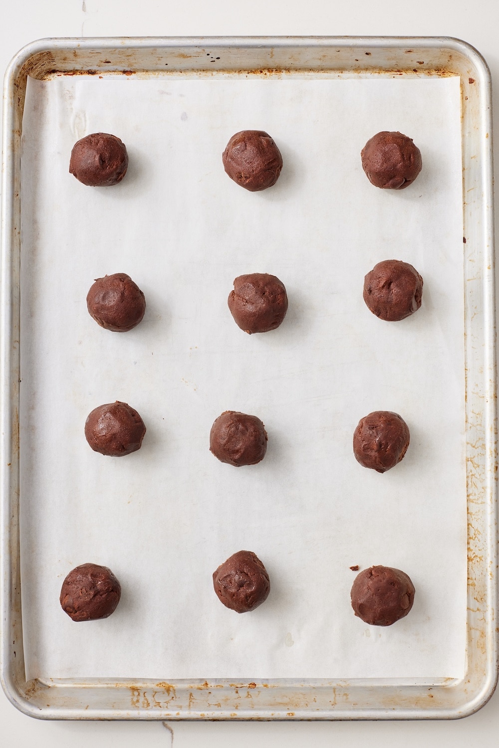 Hot Chocolate Cookies7 Scoop cookie dough into 1 tablespoon-size balls and place them two inches apart on a parchment lined tray.