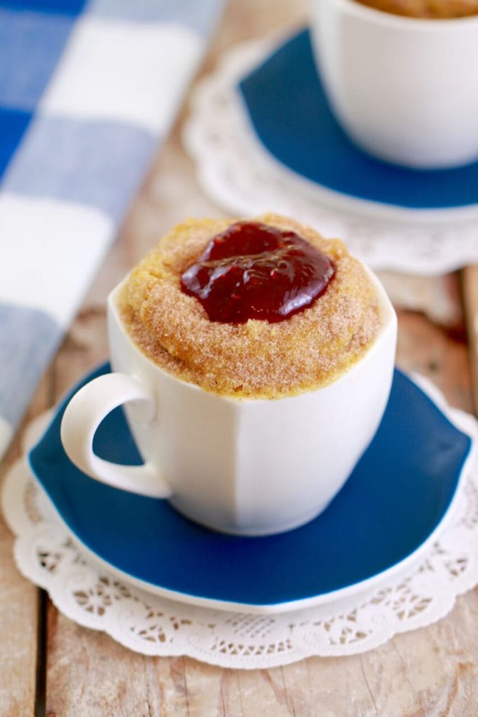 A mugnut is a donut, or doughnut, made in entirely in a mug, topped with cinnamon sugar and jelly.