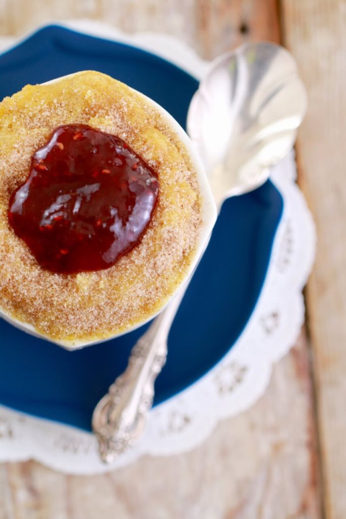 The top view of the mug donut showing the jam and texture.