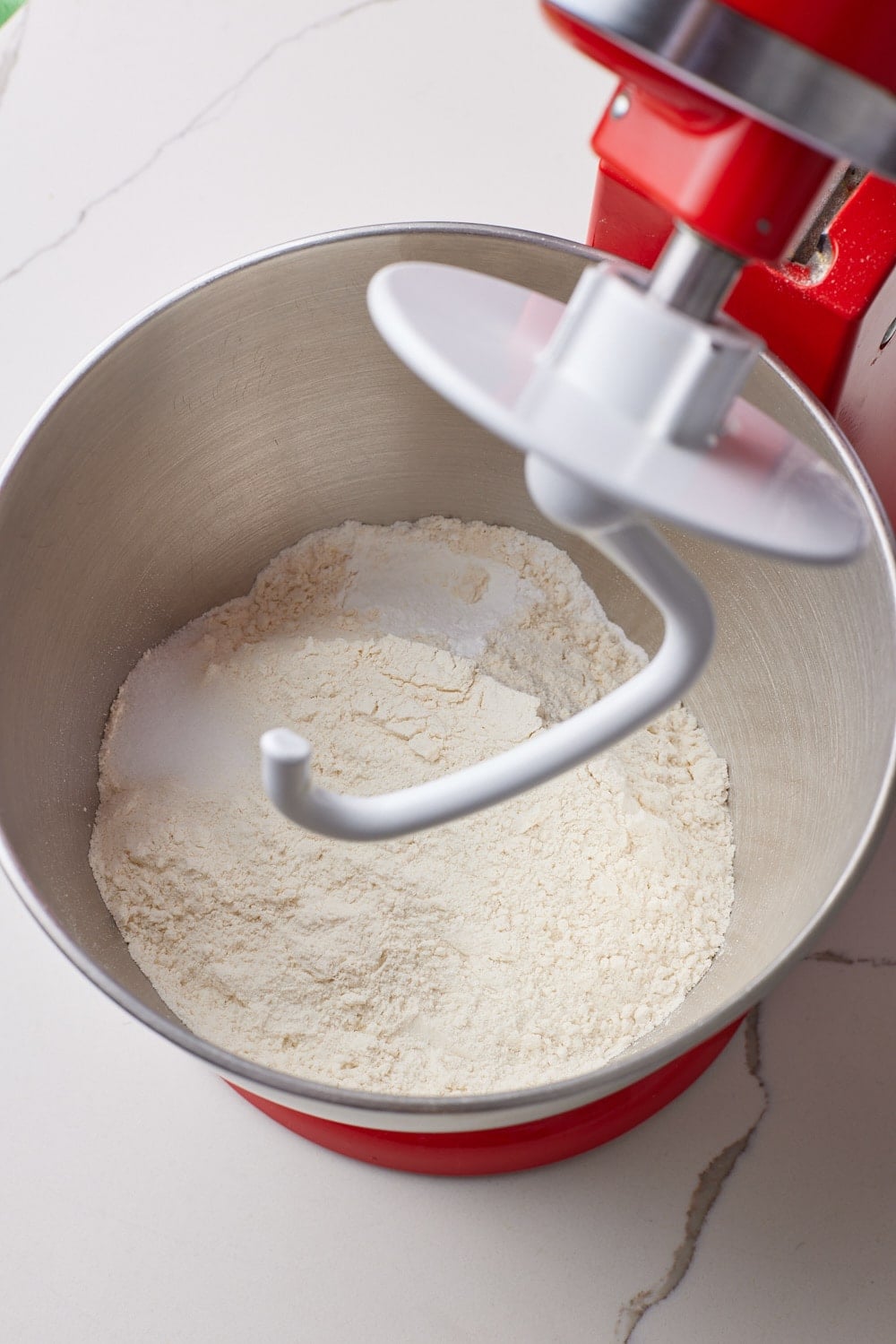 Homemade Flour Tortilla dry ingredients mixed in the bowl of a stand mixer. 