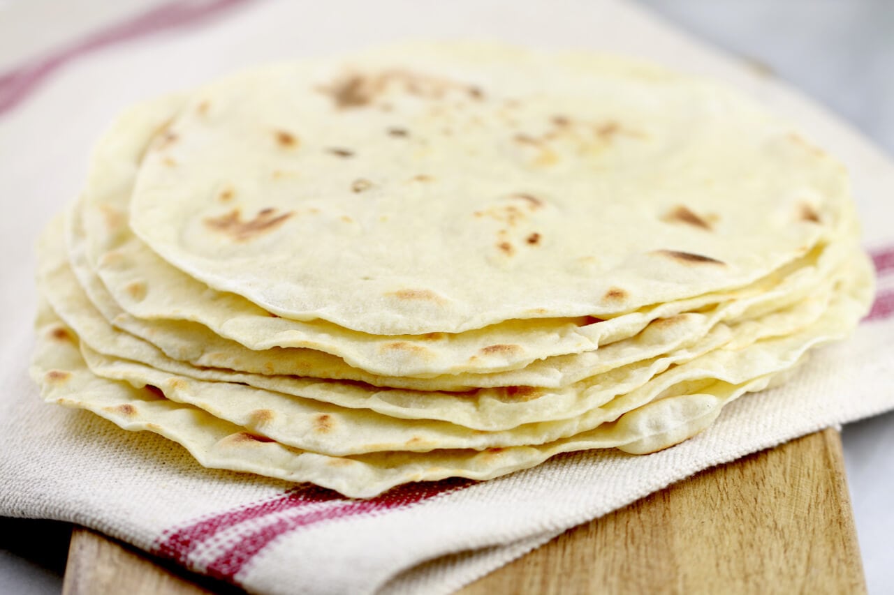 Homemade Flour Tortillas- Whip up this dough by hand in a few minutes. And they are so much better than store bought.