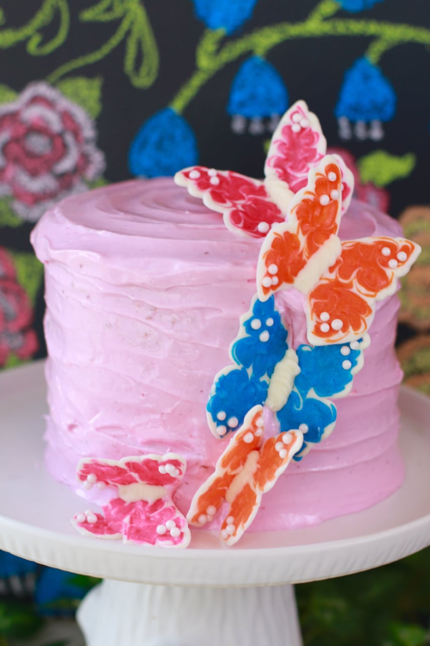 IMG_4525 White Velvet Cake with Strawberry buttercream frosting and chocolate butterflies.