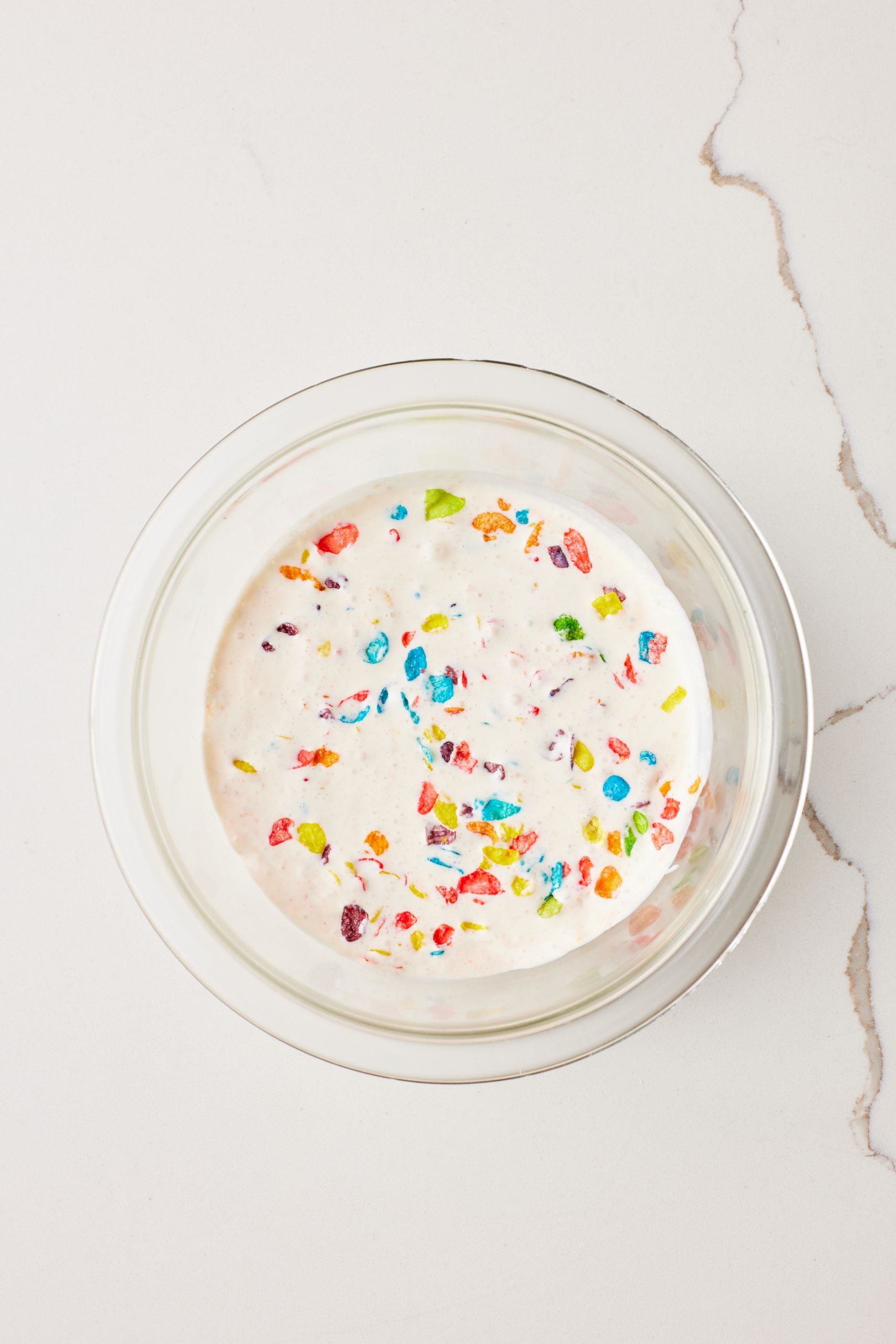 Step-by-step instructions on how to make Cereal mIlk ice cream: Soak fruity pebbles in milk