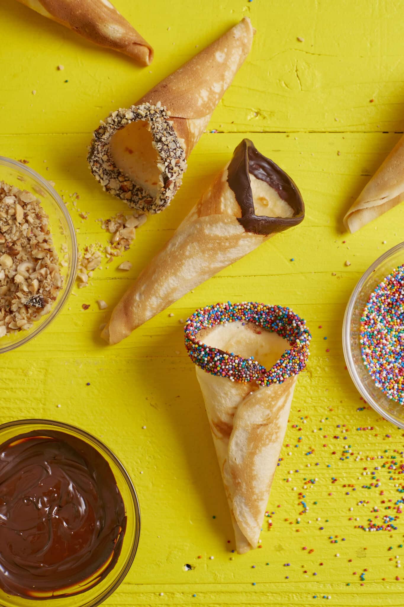 Decorate cones with melted chocolate, sprinkles, nuts or other mix-ins of your choice.