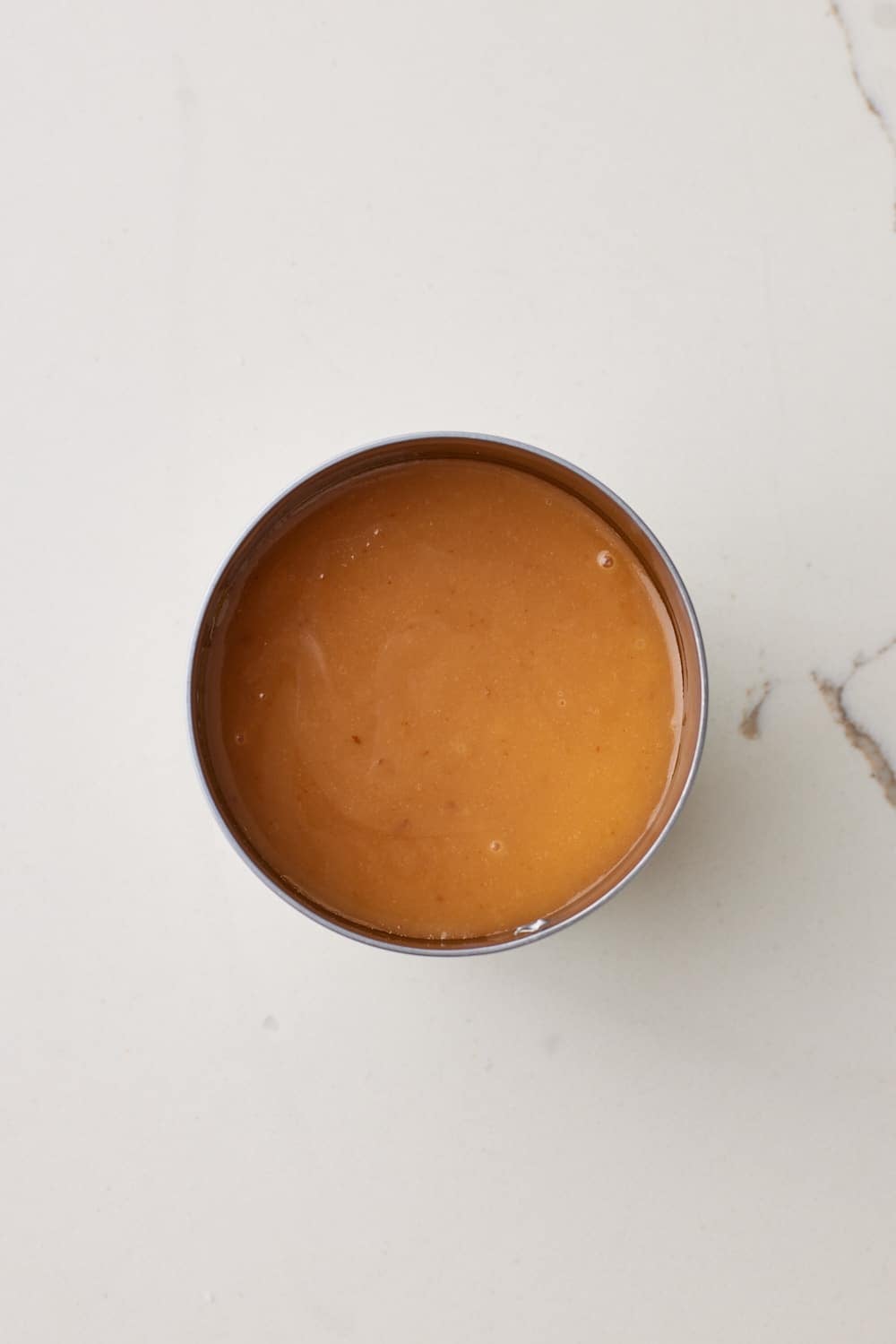 Dulce De Leche Boiling4 Top down view of a can of boiled condensed milk which turned into dulce de leche.