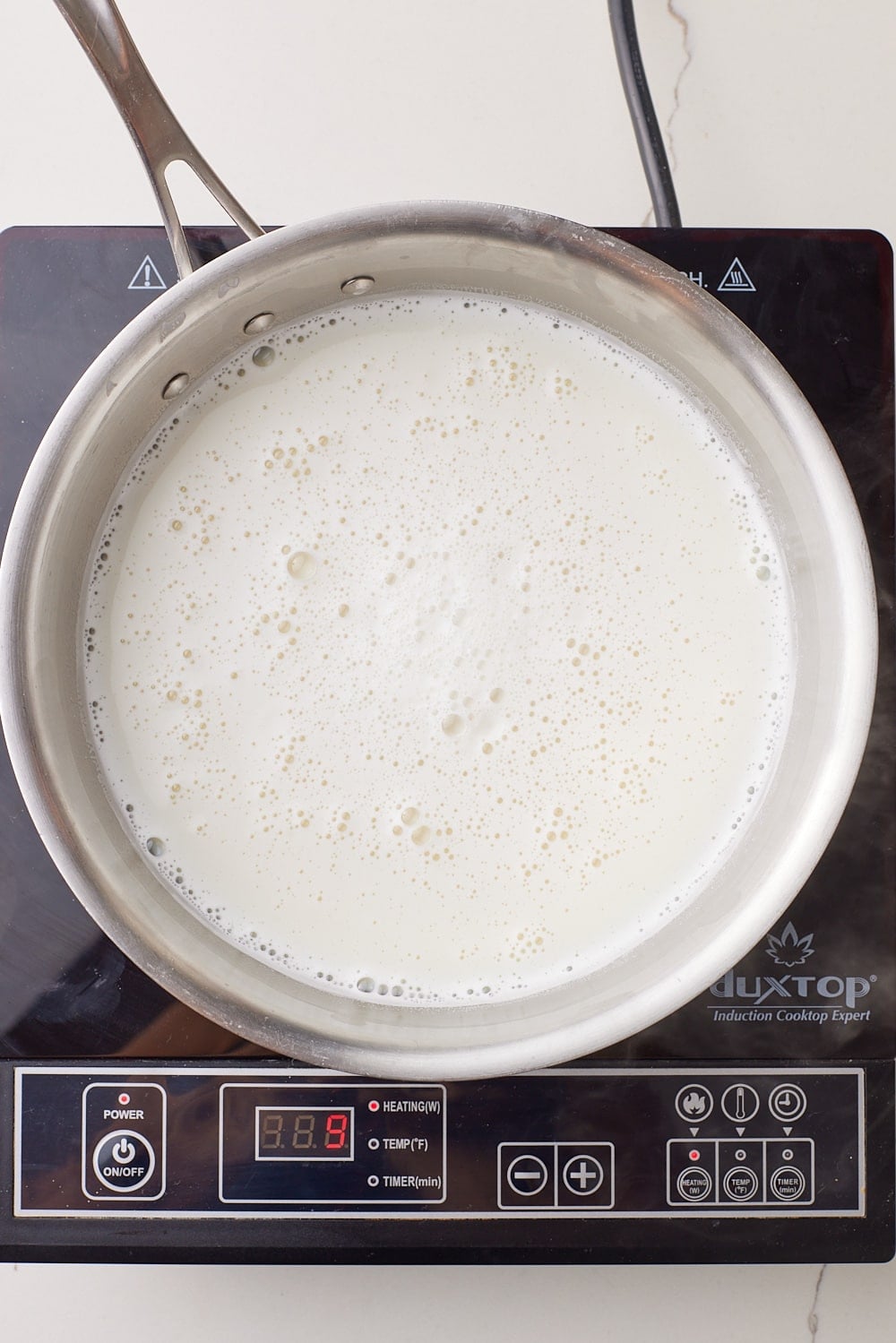 Dulce De Leche Classic2 Add milk, sugar, and baking soda to pan.