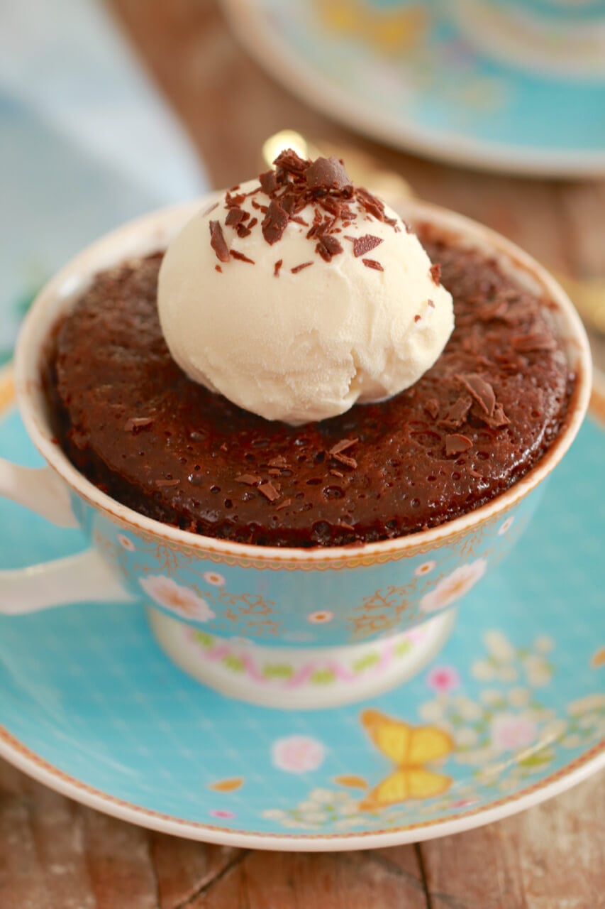 Finished 3-Ingredient Nutella Brownie in a Mug, topped with vanilla ice cream).