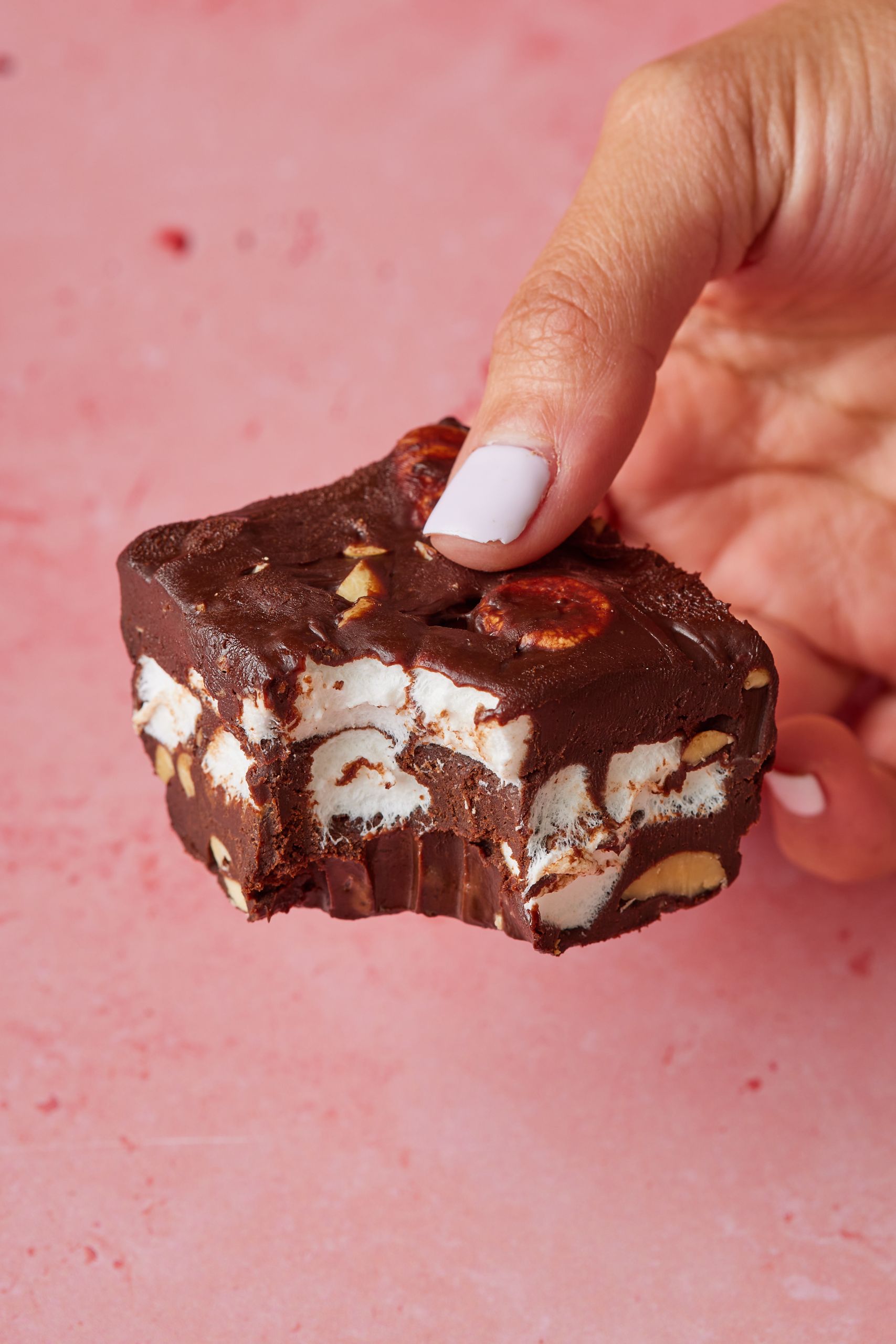 A rocky road fudge with one bite taken