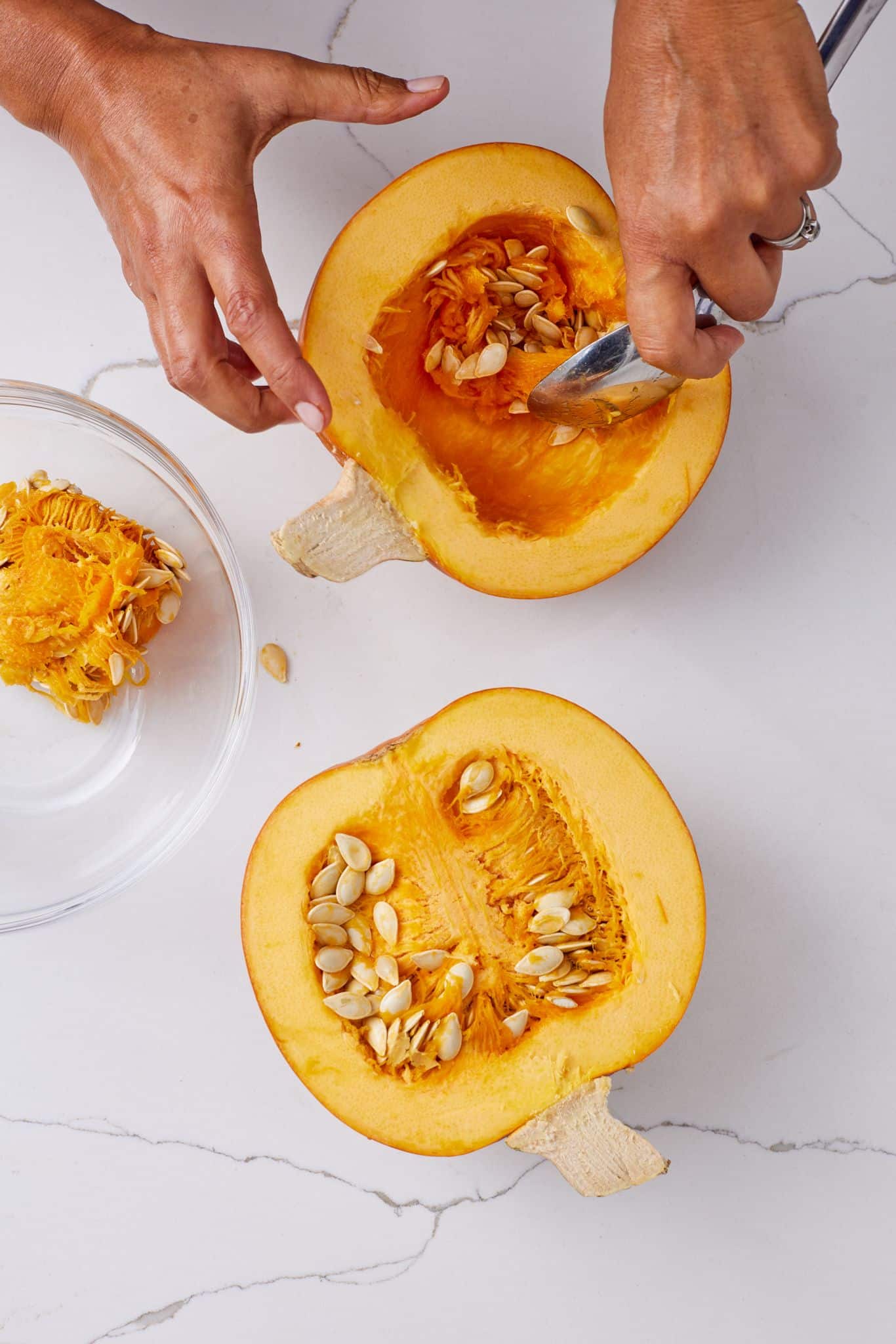 Step-by-step instructions on how to make pumpkin puree: scoop pumpkin seeds.