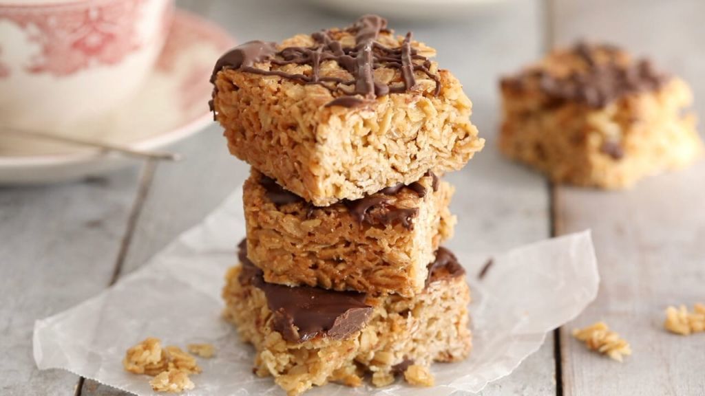 Irish Oat Flapjacks - The perfect traditional Irish treat, stacked, topped with chocolate.