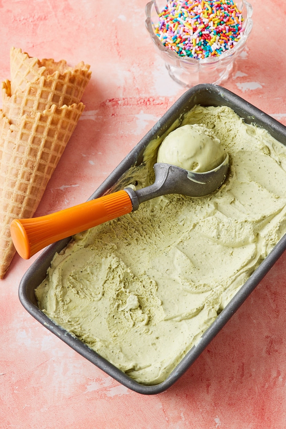 Green tea ice-cream7 Green Tea Ice Cream served with ice cream cones and sprinkles.
