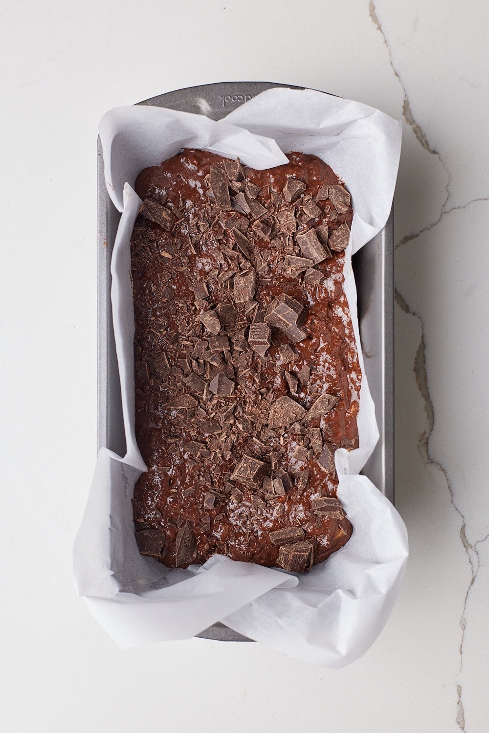 Healthy Chocolate Banana Bread batter in a loaf tin. 