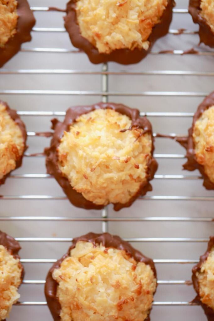 Coconut macaroons are golden and crispy on top. The bottom is coated with chocolate.