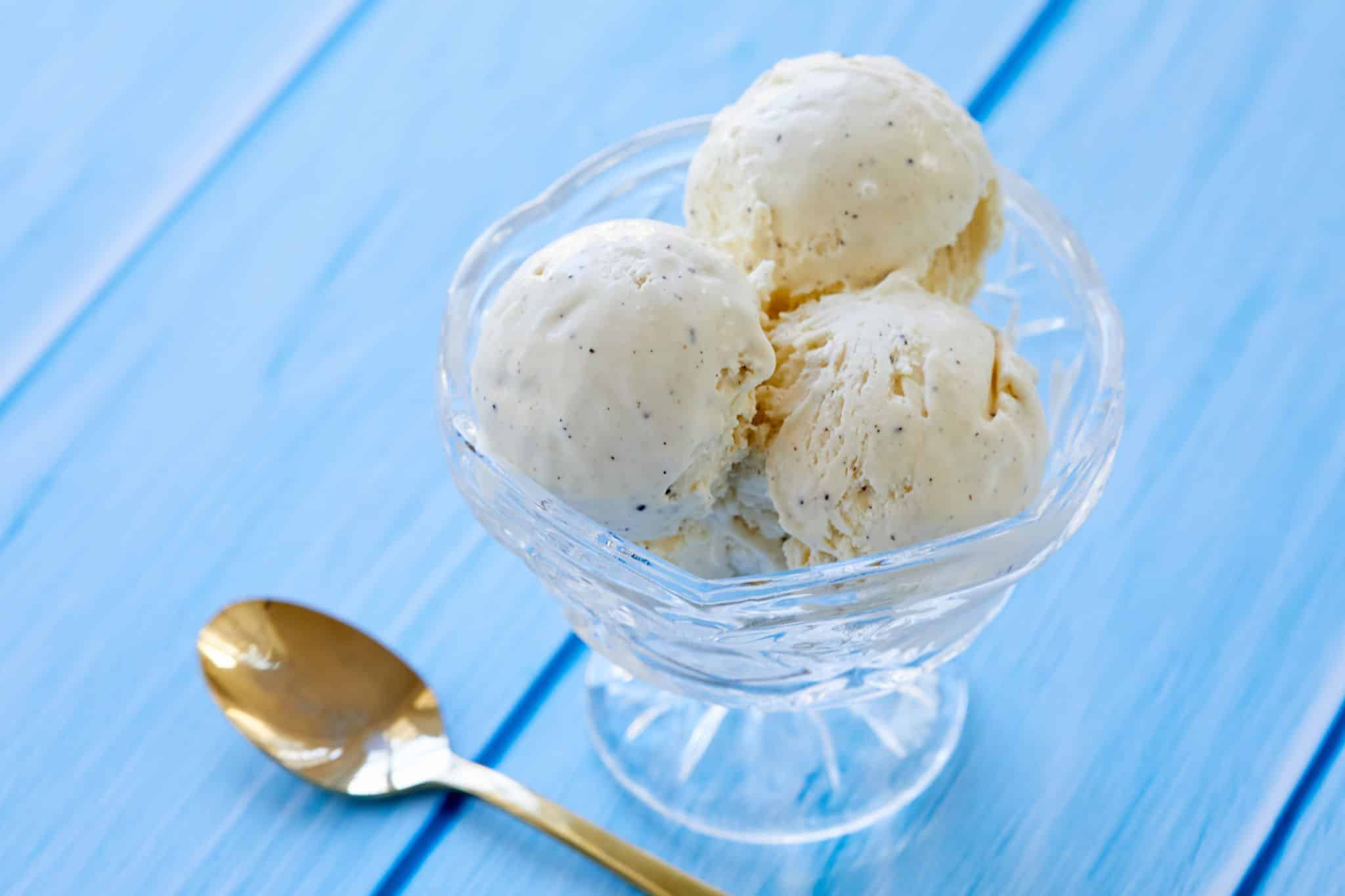 A bowl of 3 scoops of the simplest velvety, floral and creamy frozen dessert vanilla ice Crean with no ice cream maker