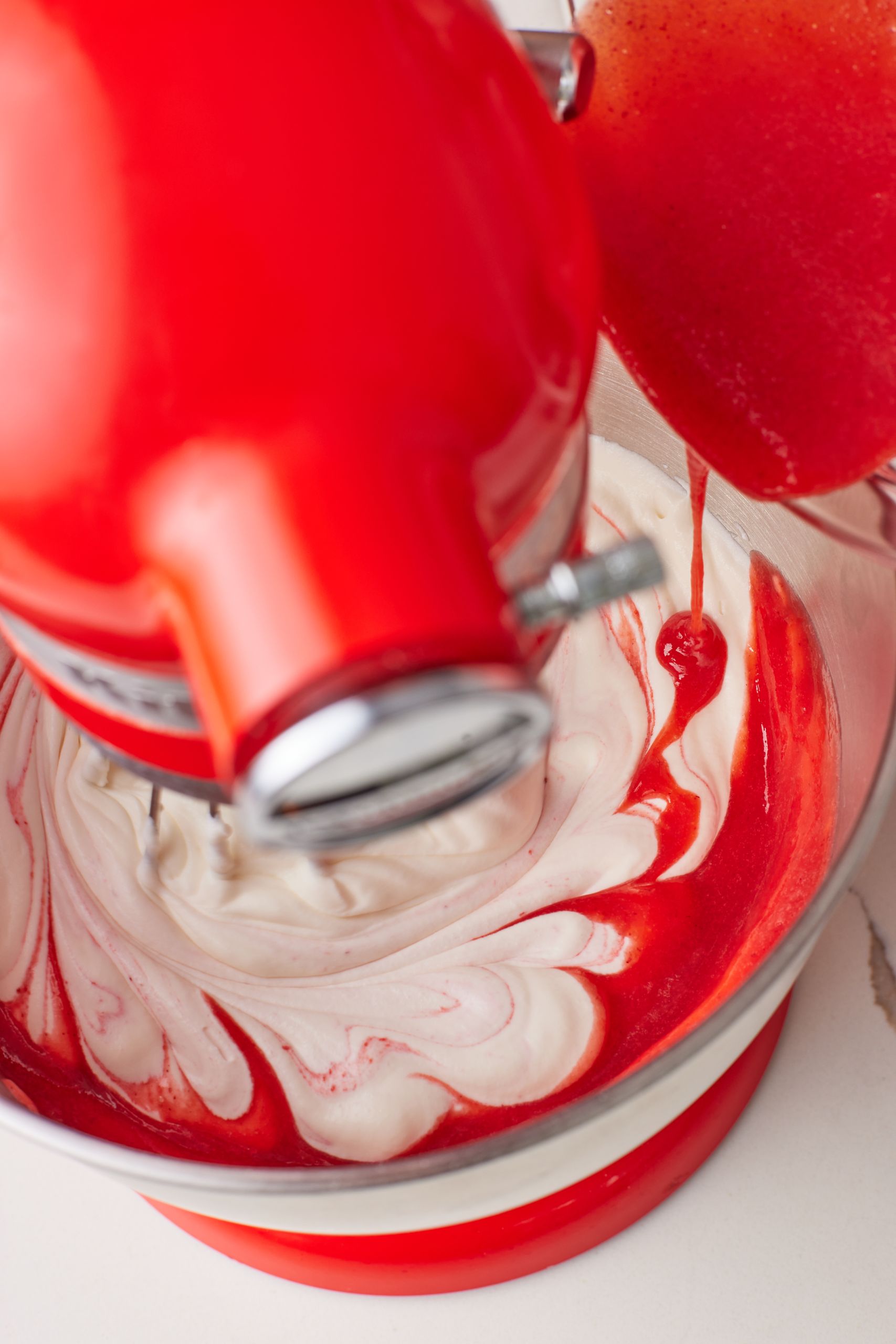 Stir in vanilla extract and strawberry puree and whip until combined