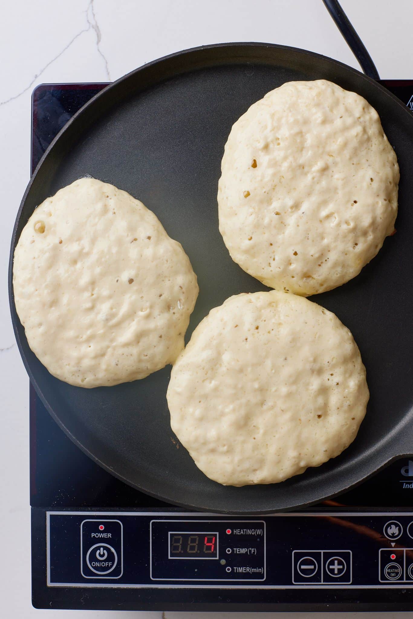 Cook pancakes until bubbles form on top and edges look set. 