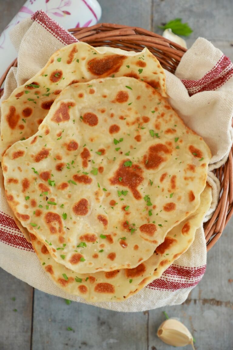 A basket is filled with homemade flatbread.
