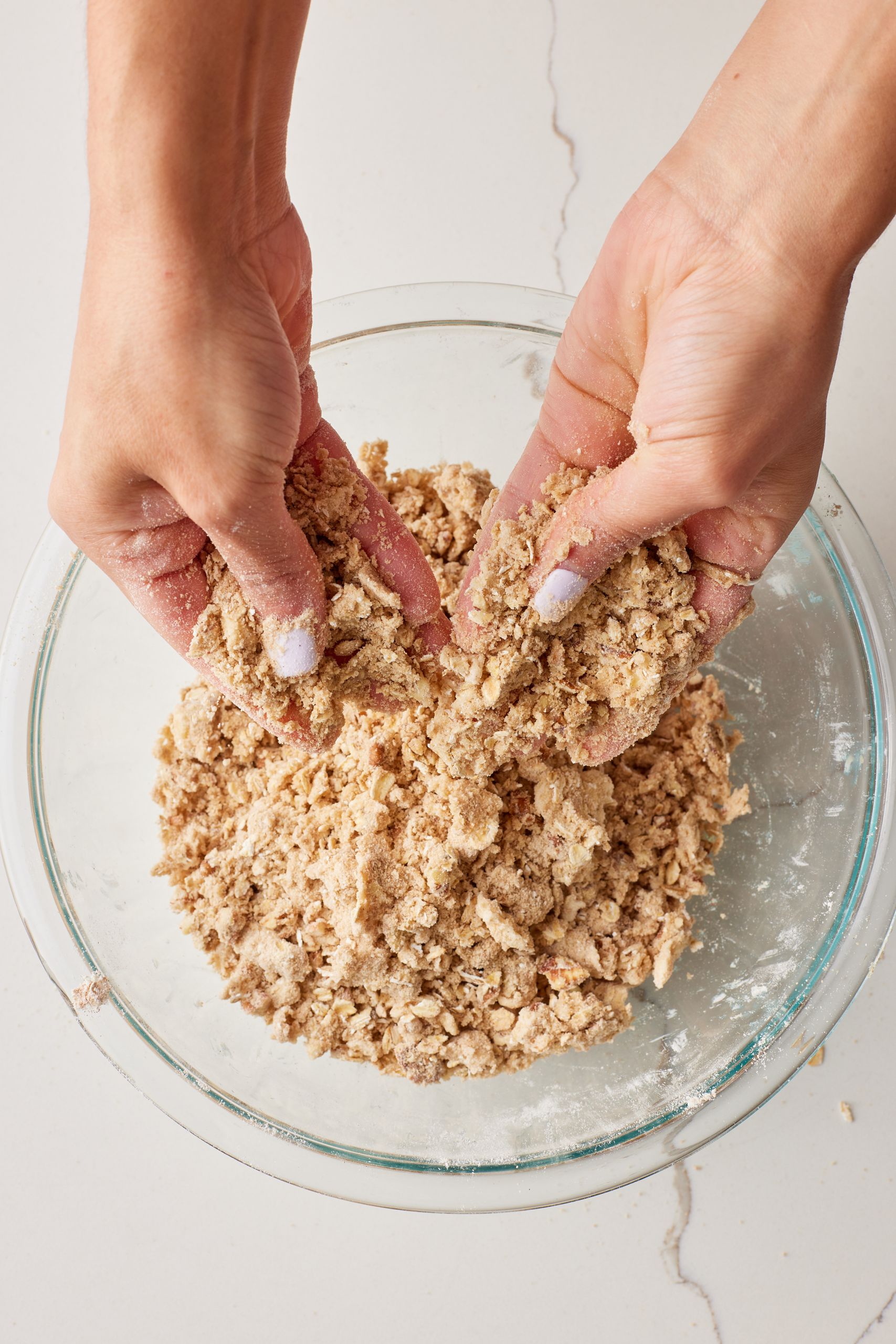 Rub butter in until it forms small pea-size lumps.