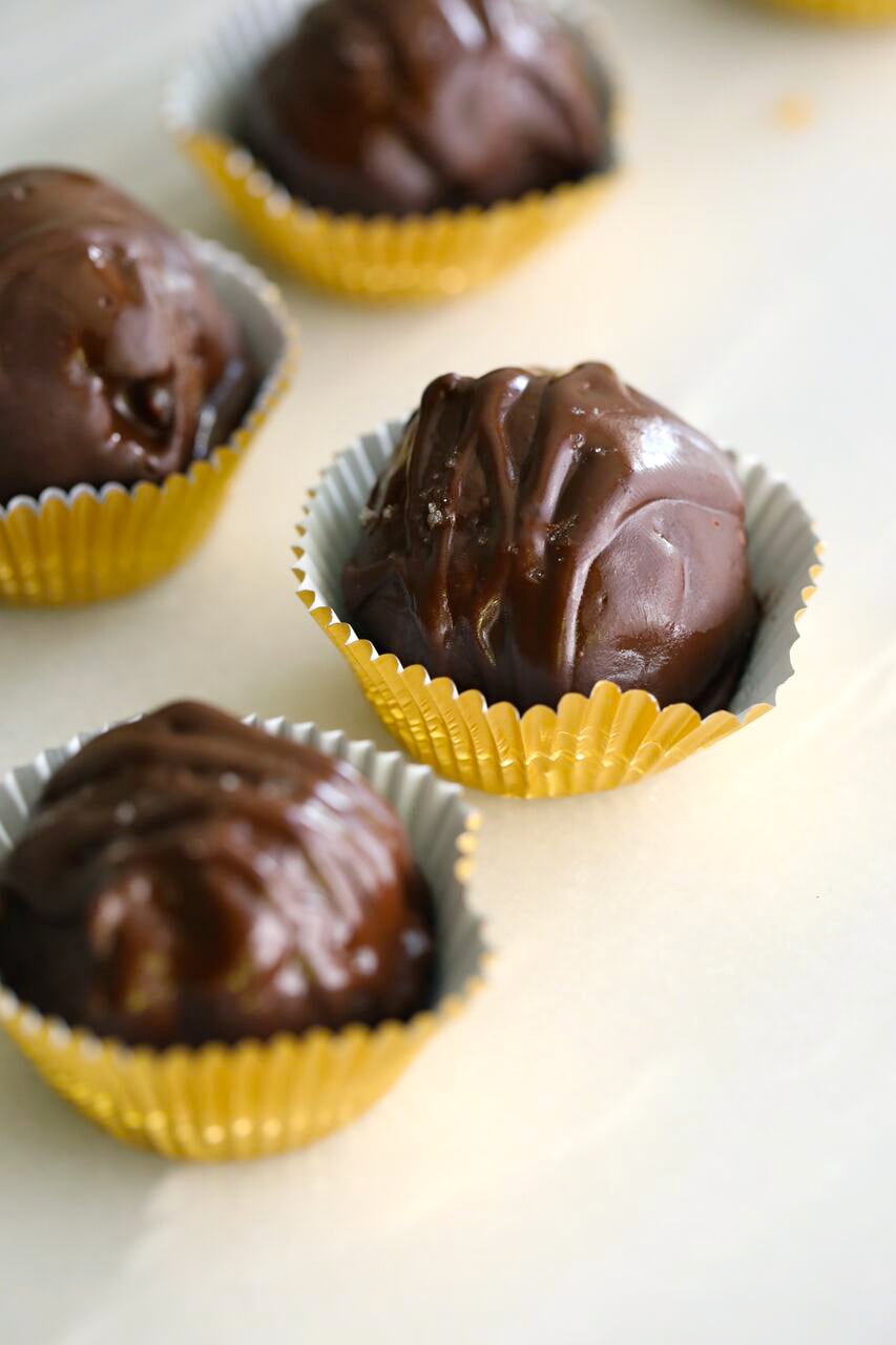 cookiedoughtrufflesfinal5 Healthy Cookie Dough Truffles in golden liner.