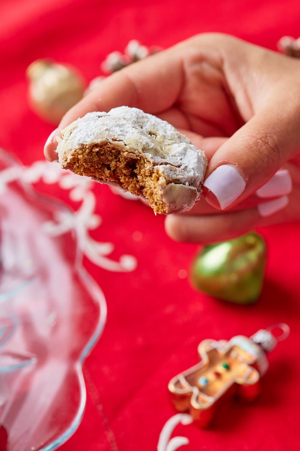 A Ginger Crinkle Cookie with a bite taken. 