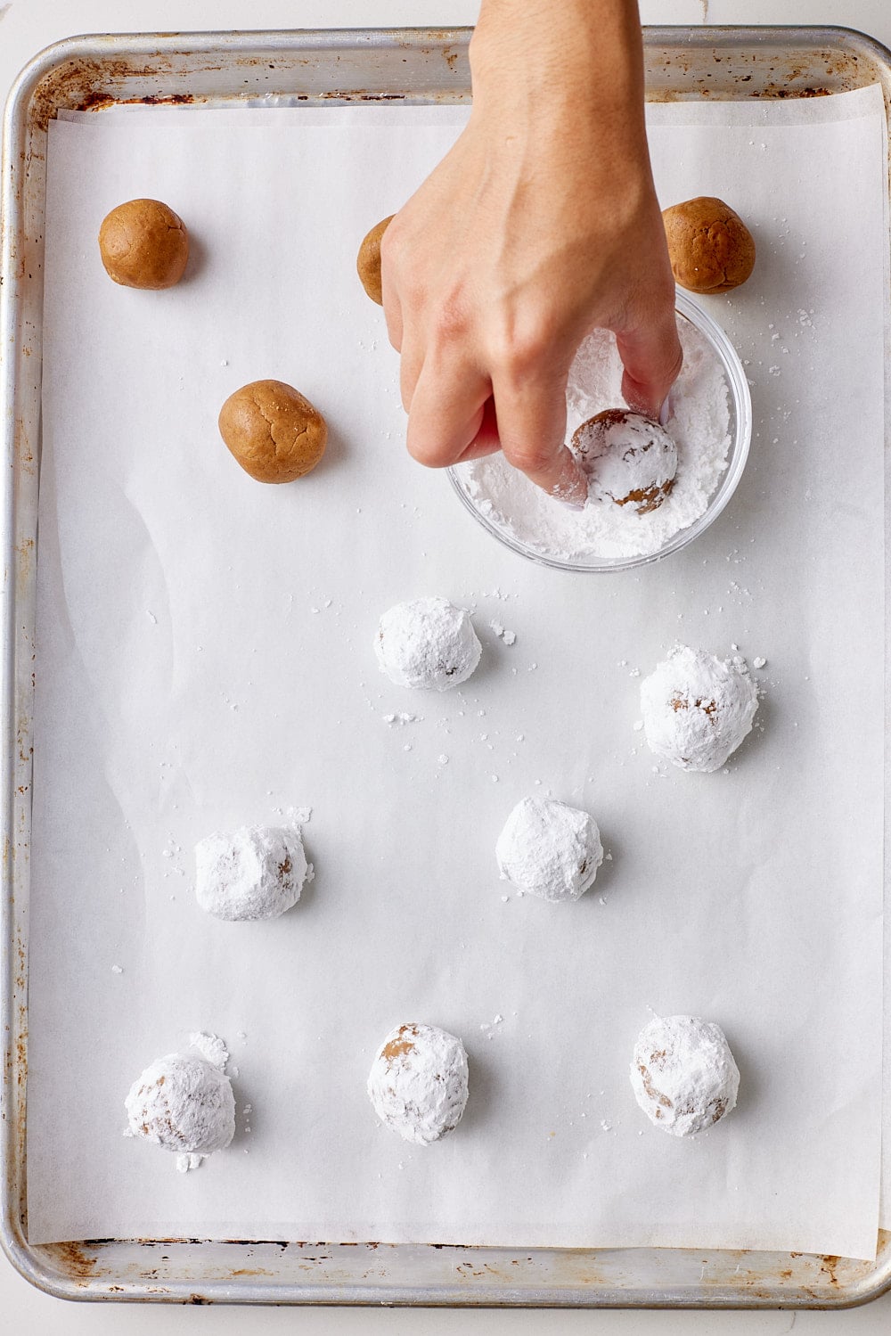Roll each ball in powdered sugar twice until generously coated.