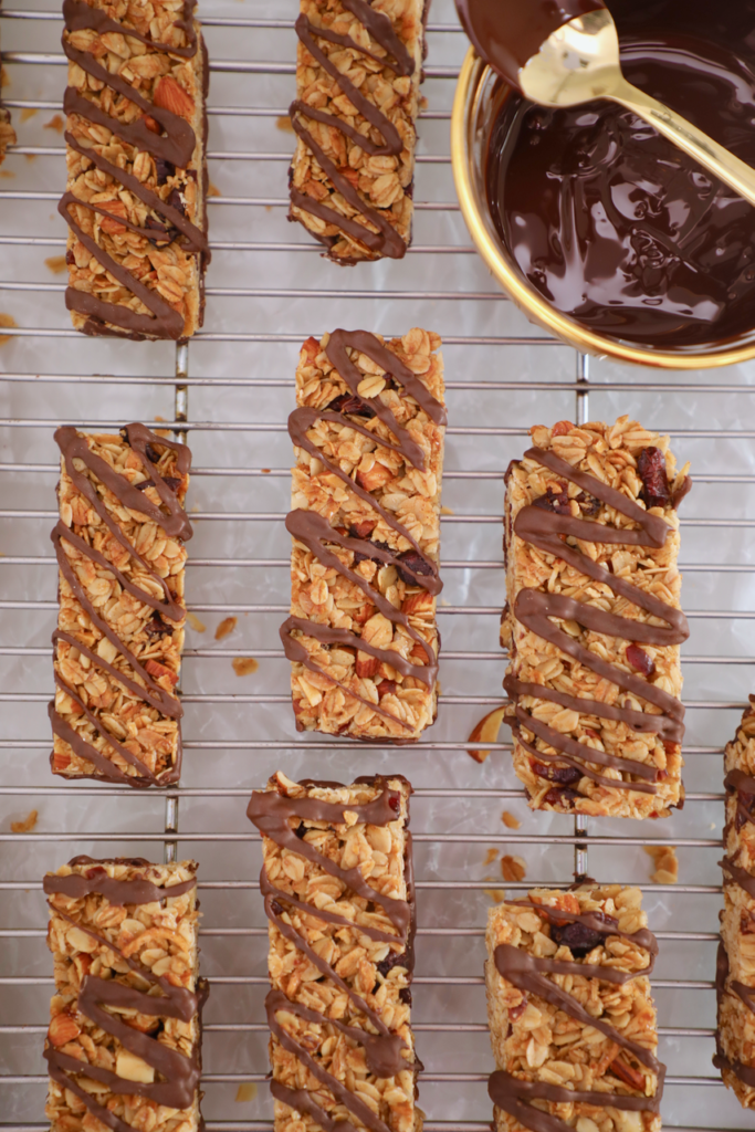 A top-down view of these easy granola bars, baked, and drizzled with chocolate.
