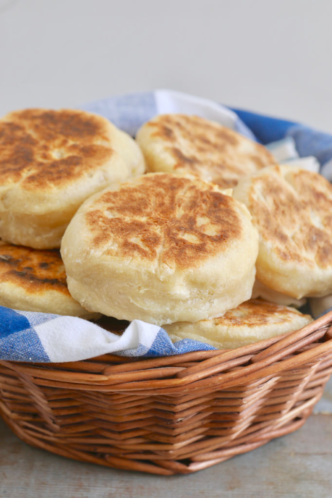 No-Knead English Muffins are golden brown on top and look soft and fluffy.