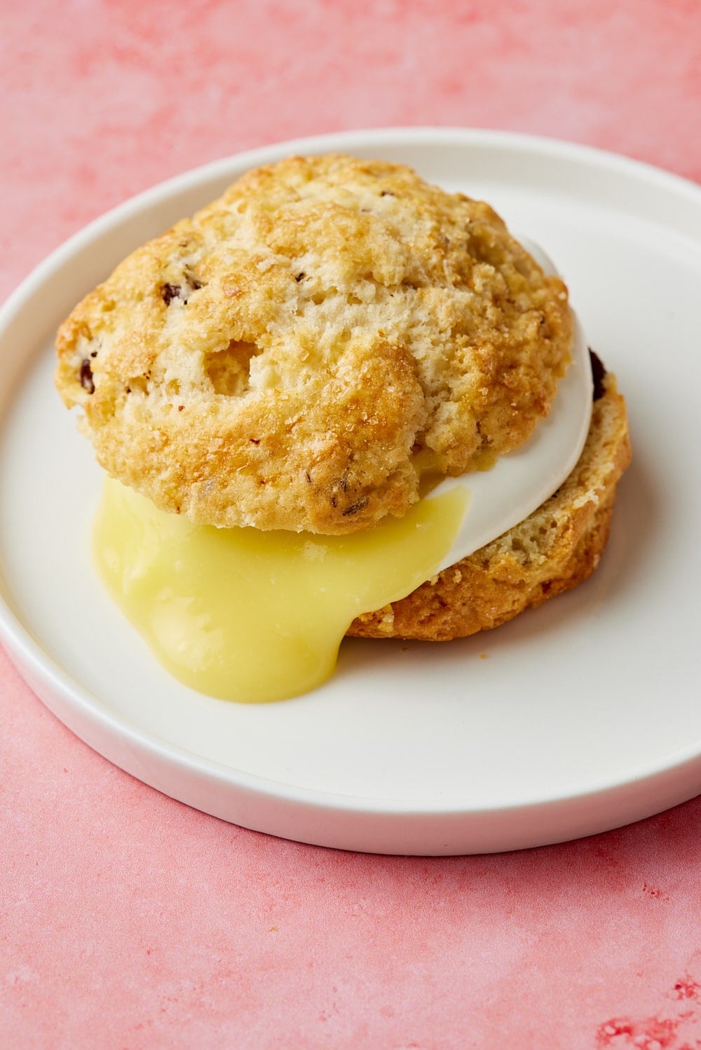 A scone served with lemon curd.
