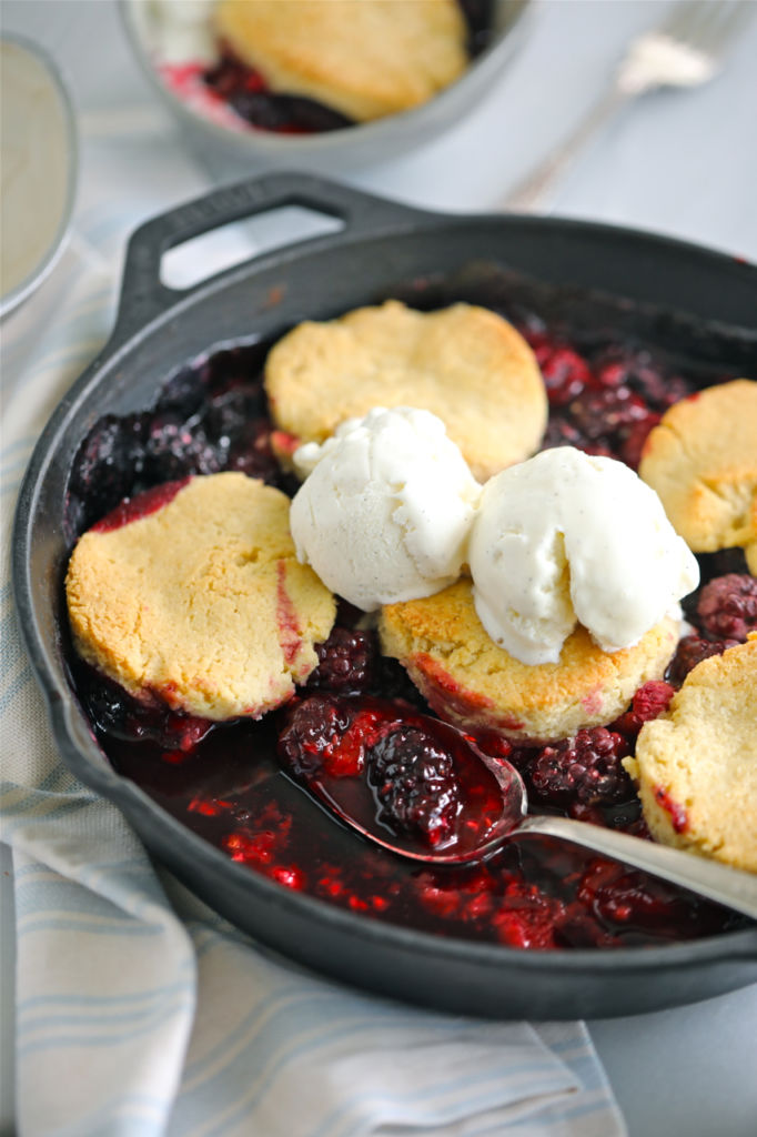 Low sugar cobbler with biscuits and ice cream on top.