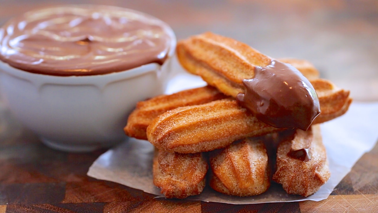 Baked Churros dipped in chocolate.