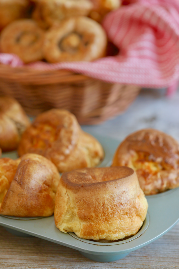 Popovers, or Yorkshire Pudding, popped over in their baking tin.