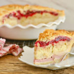 Thanksgiving Leftovers Pie, sliced and ready to eat, showing all the layers of turkey, mash, and cranberry sauce