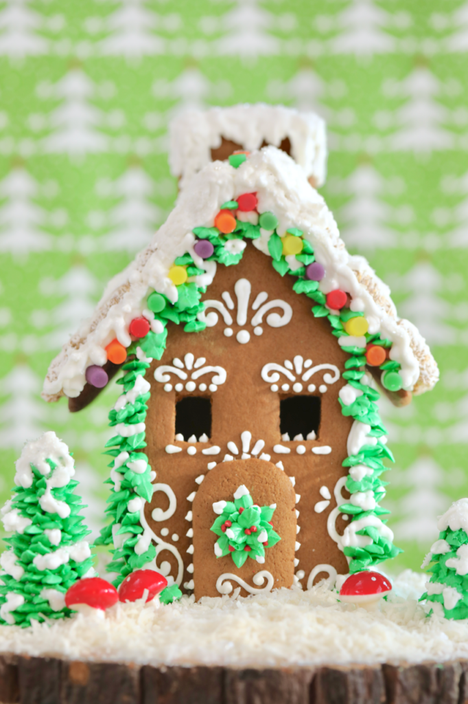 The Ultimate Homemade Gingerbread House Kit fully decorated and assembled.