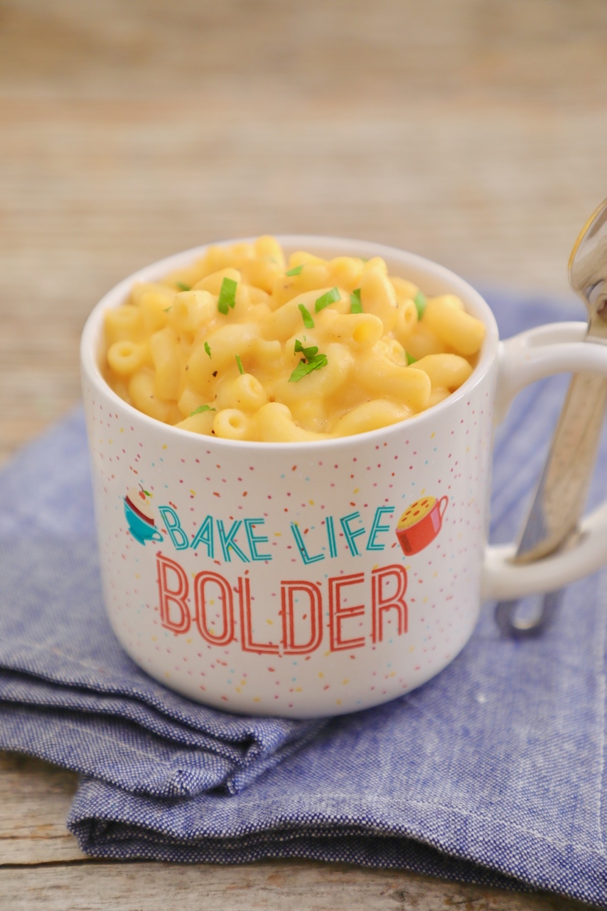 Mac and Cheese, fully cooked, in a mug having been baked in the microwave.