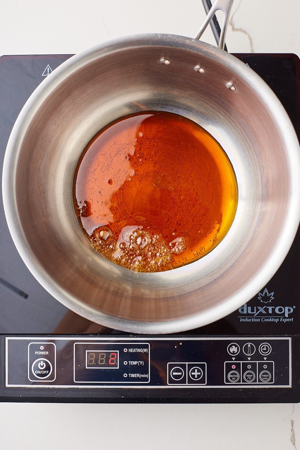 Golden Syrup8 Top-down view of golden syrup reached a rich amber color and slightly thickened.