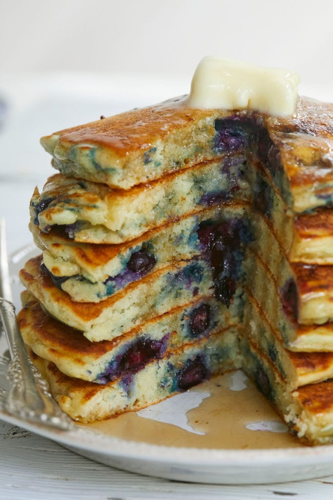 A cross section of Homemade Blueberry Pancakes, to show blueberries and texture.