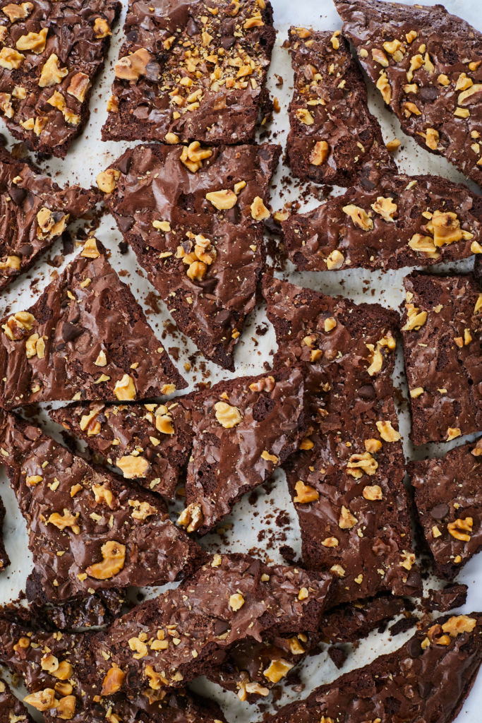 Shards of broken Brownie Brittle, topped with walnuts.
