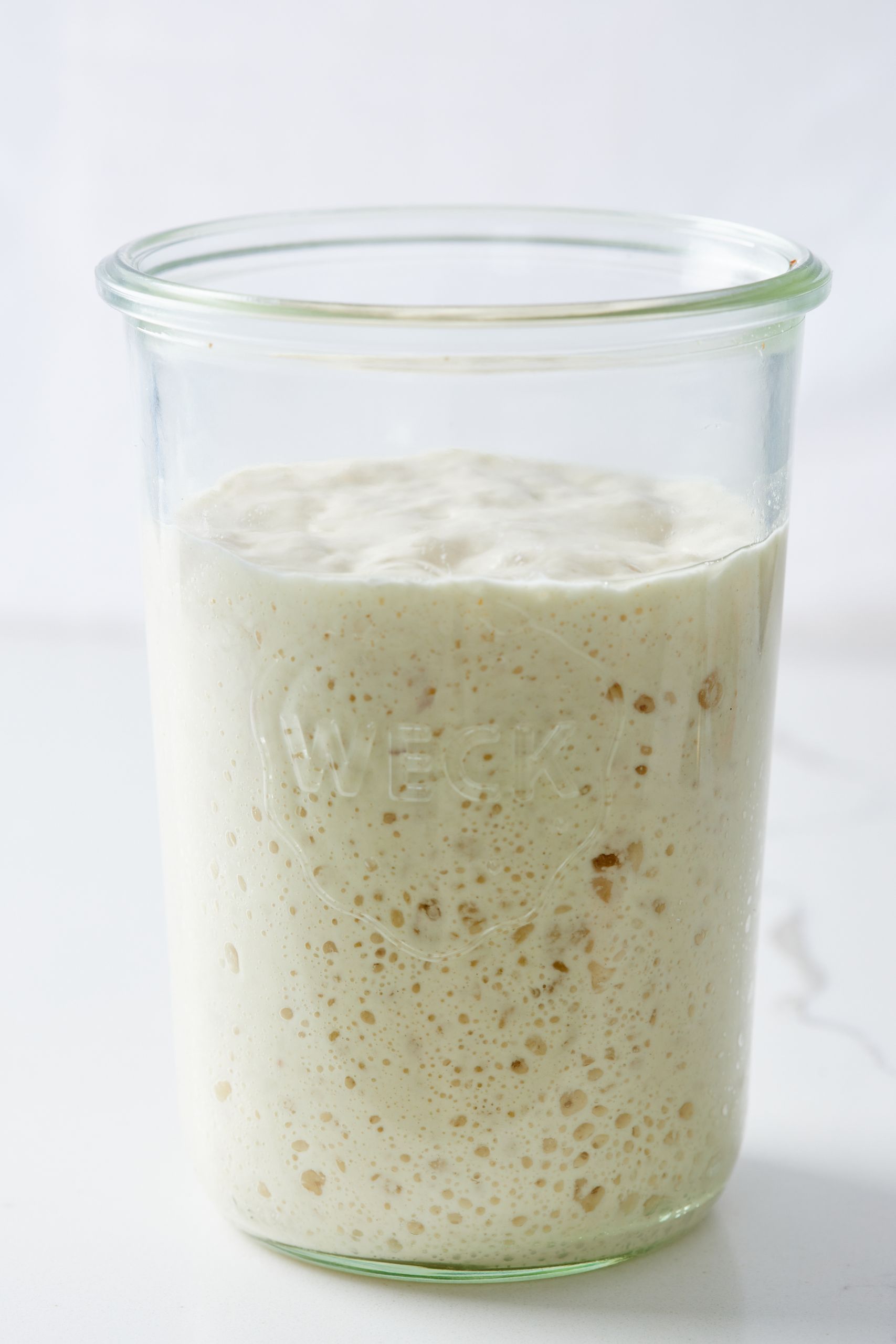Ongoing care of starter: As the yeast begins to develop, your starter will rise, and bubbles will form on the surface and throughout the culture. 