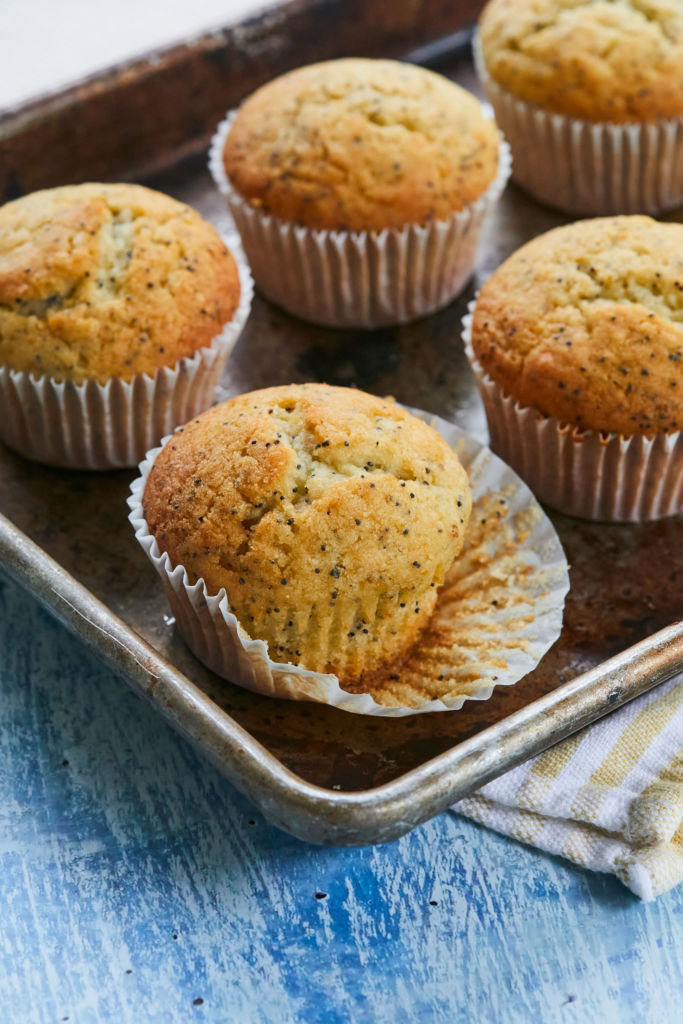 Lemon Poppy Seed Muffins recipe, arranged on a tray, ready to eat