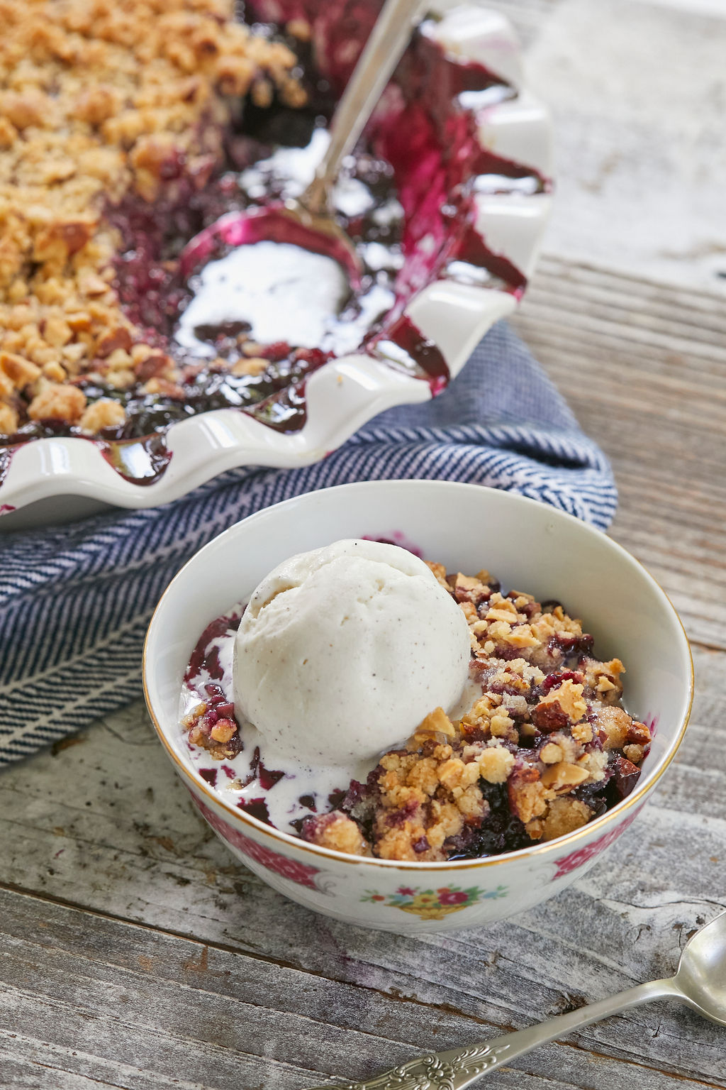 A serving of my Blueberry Crisp, topped with vanilla ice cream.