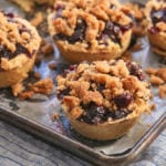 Blueberry Crumb Pies on a Baking Tray.