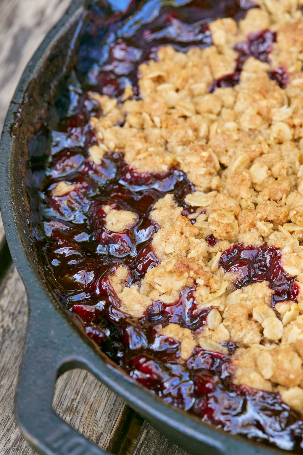 A close up of my Homemade Skillet Cherry Crisp after baking, to show texture, color, and consistency.