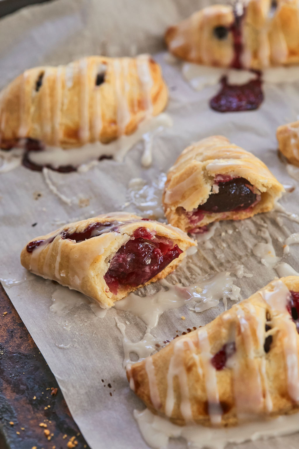 A cross section of cherry hand pies recipe to show the cherry filling.