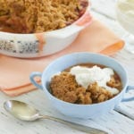 Simple Rhubarb Crisp recipe topped with whipped cream.