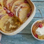 White Chocolate, Whiskey, and Raspberry Bread Pudding recipe serving with whipped cream.